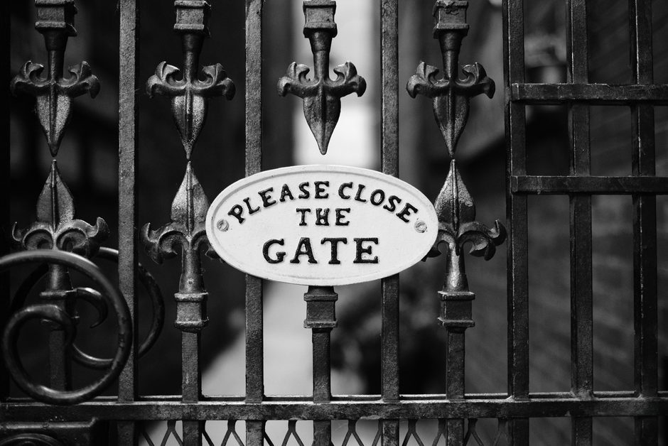 A black metal gate closed across an entrance