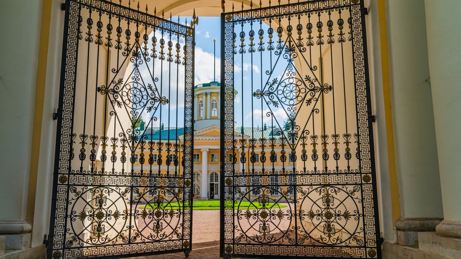 A black metal gate closed across an entrance