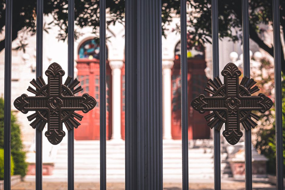 An iron gate with ornamental detail
